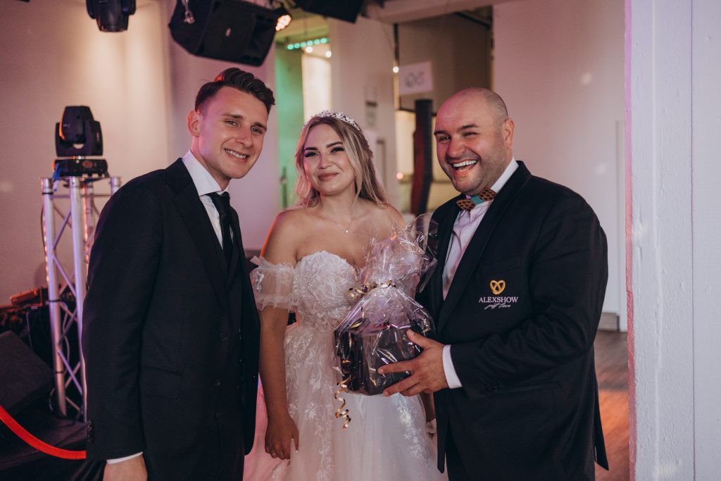Wedding moderator and Tamada Ivan creating a joyful and lively atmosphere during a wedding reception in Germany.