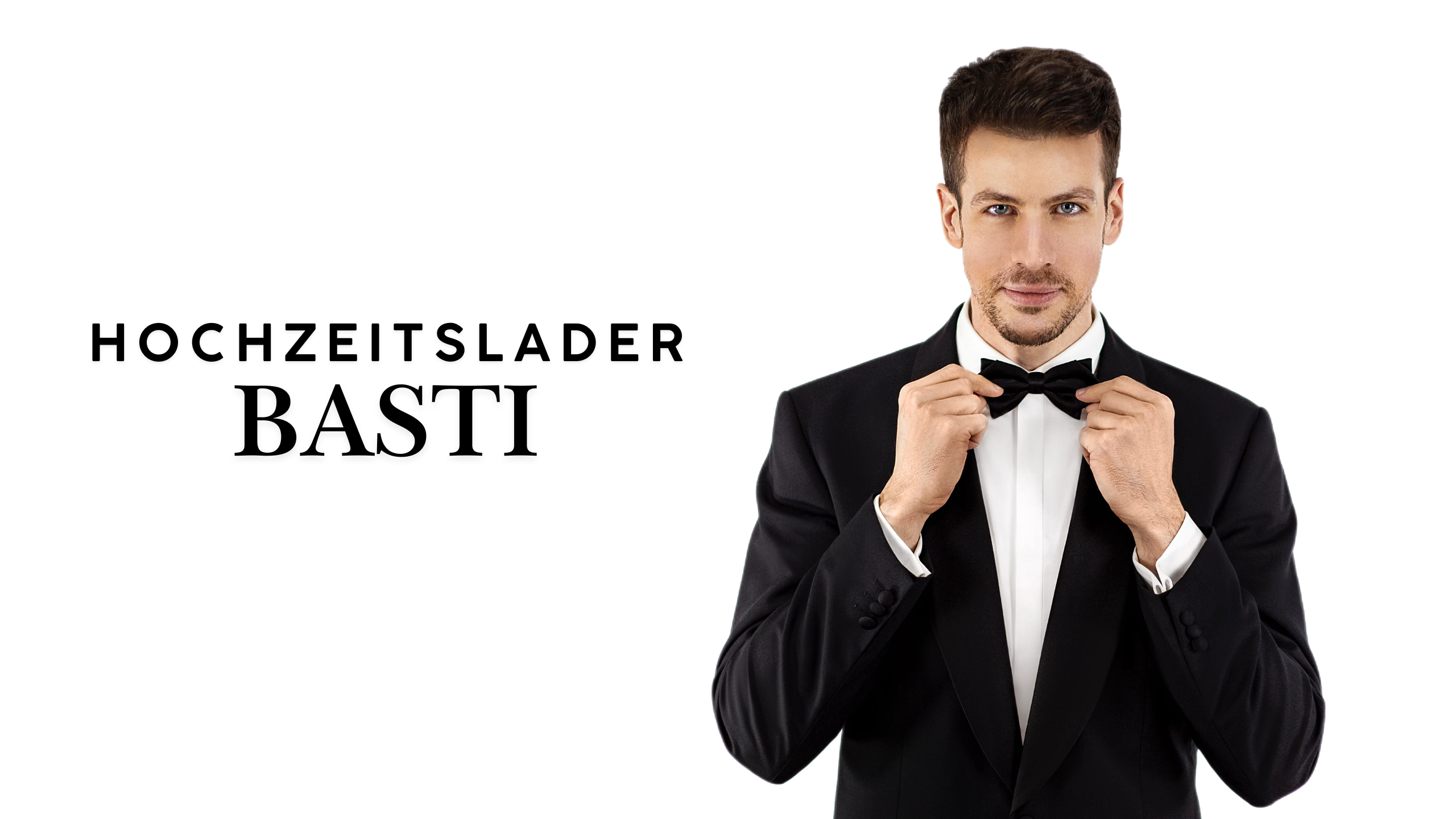 Hochzeitslader Basti im schwarzen Anzug mit Fliege